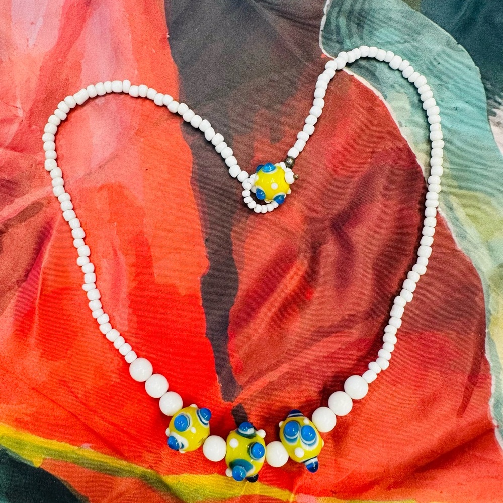 Handcrafted White Bead Necklace with Yellow & Blue Accent Beads